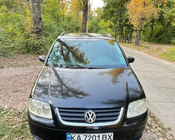 Чорний Фольксваген Туран, об'ємом двигуна 1.9 л та пробігом 402 тис. км за 5700 $, фото 1 на Automoto.ua