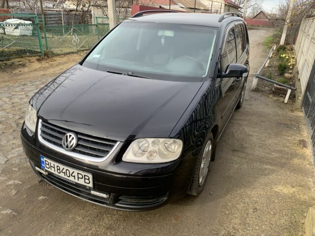 Черный Фольксваген Туран, объемом двигателя 1.6 л и пробегом 260 тыс. км за 5100 $, фото 1 на Automoto.ua