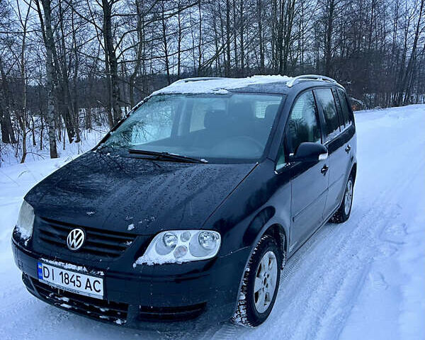 Чорний Фольксваген Туран, об'ємом двигуна 1.97 л та пробігом 300 тис. км за 4999 $, фото 1 на Automoto.ua