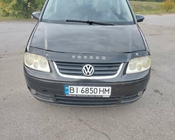 Чорний Фольксваген Туран, об'ємом двигуна 2 л та пробігом 350 тис. км за 5500 $, фото 1 на Automoto.ua