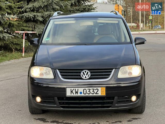 Черный Фольксваген Туран, объемом двигателя 1.6 л и пробегом 192 тыс. км за 4900 $, фото 1 на Automoto.ua