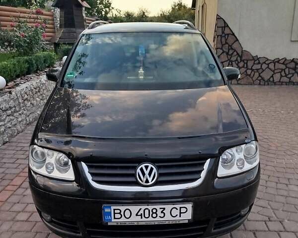 Черный Фольксваген Туран, объемом двигателя 1.6 л и пробегом 167 тыс. км за 6000 $, фото 1 на Automoto.ua