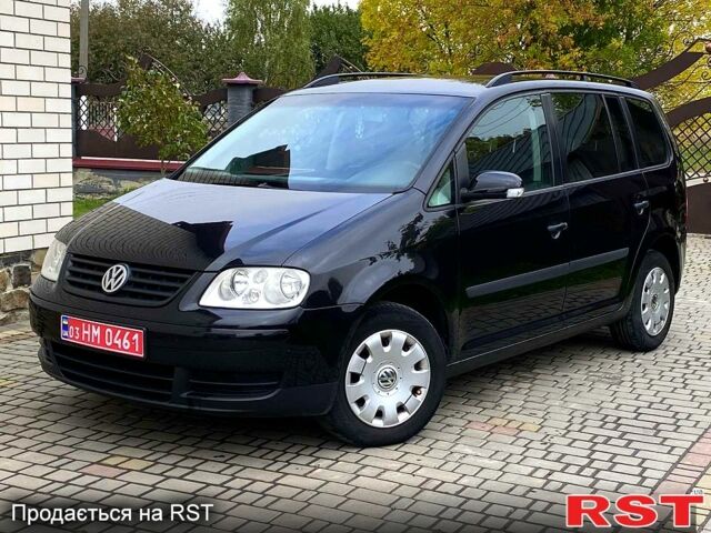 Черный Фольксваген Туран, объемом двигателя 1.6 л и пробегом 230 тыс. км за 5200 $, фото 1 на Automoto.ua