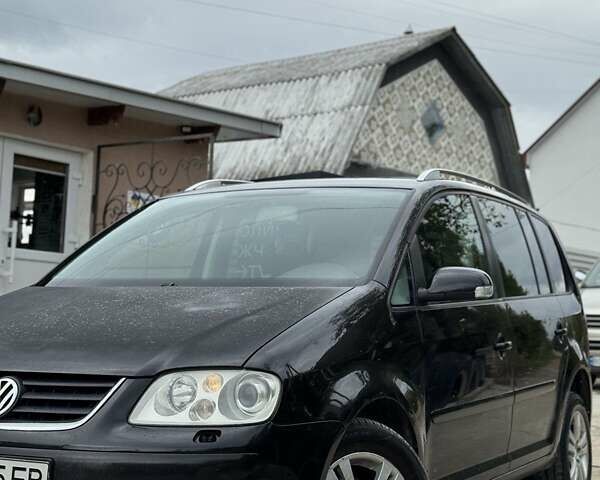 Черный Фольксваген Туран, объемом двигателя 1.98 л и пробегом 336 тыс. км за 5750 $, фото 1 на Automoto.ua
