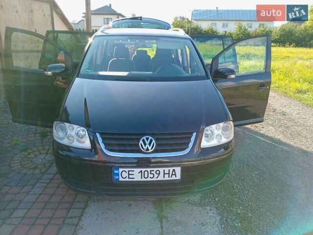 Черный Фольксваген Туран, объемом двигателя 1.6 л и пробегом 309 тыс. км за 5900 $, фото 1 на Automoto.ua