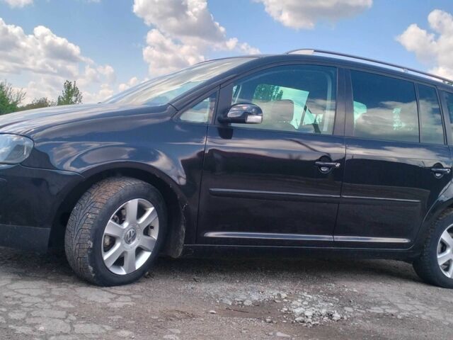 Черный Фольксваген Туран, объемом двигателя 2 л и пробегом 260 тыс. км за 6500 $, фото 1 на Automoto.ua