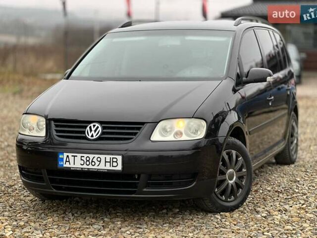 Черный Фольксваген Туран, объемом двигателя 1.6 л и пробегом 208 тыс. км за 5700 $, фото 1 на Automoto.ua
