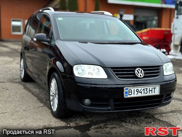 Черный Фольксваген Туран, объемом двигателя 1.9 л и пробегом 310 тыс. км за 5499 $, фото 1 на Automoto.ua