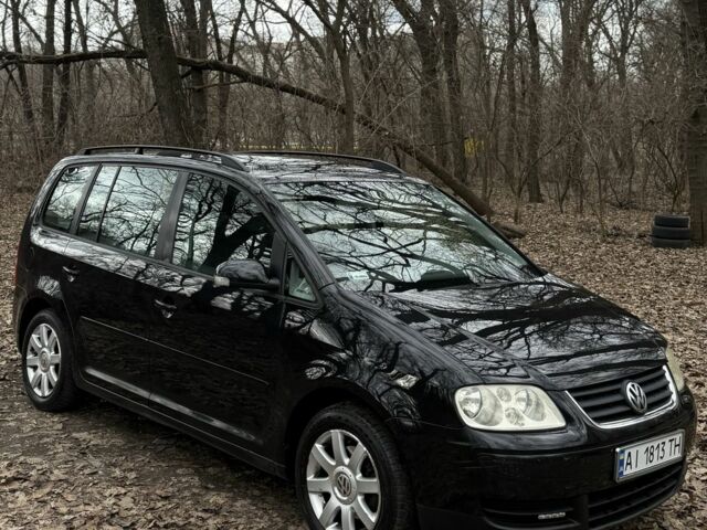 Черный Фольксваген Туран, объемом двигателя 2 л и пробегом 300 тыс. км за 4050 $, фото 1 на Automoto.ua