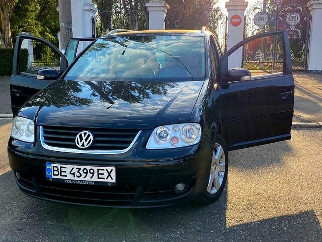 Черный Фольксваген Туран, объемом двигателя 2 л и пробегом 265 тыс. км за 5800 $, фото 1 на Automoto.ua