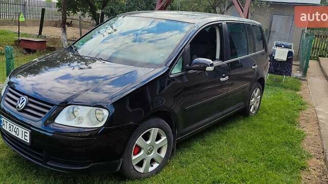 Черный Фольксваген Туран, объемом двигателя 1.6 л и пробегом 261 тыс. км за 6200 $, фото 1 на Automoto.ua