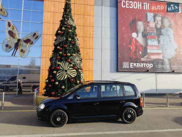 Черный Фольксваген Туран, объемом двигателя 1.6 л и пробегом 219 тыс. км за 5850 $, фото 1 на Automoto.ua