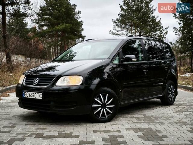 Черный Фольксваген Туран, объемом двигателя 2 л и пробегом 321 тыс. км за 5500 $, фото 1 на Automoto.ua