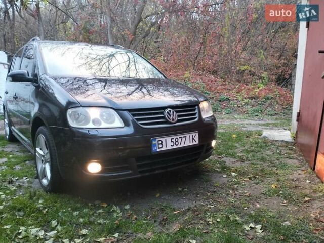 Черный Фольксваген Туран, объемом двигателя 1.9 л и пробегом 334 тыс. км за 5500 $, фото 1 на Automoto.ua