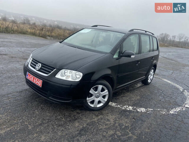 Черный Фольксваген Туран, объемом двигателя 1.6 л и пробегом 198 тыс. км за 6800 $, фото 1 на Automoto.ua
