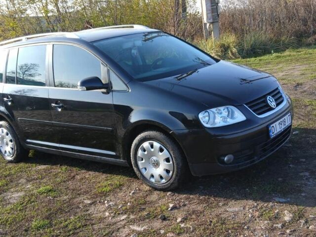 Черный Фольксваген Туран, объемом двигателя 2 л и пробегом 290 тыс. км за 6000 $, фото 1 на Automoto.ua