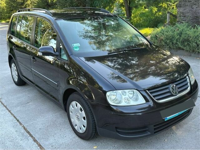 Черный Фольксваген Туран, объемом двигателя 1.9 л и пробегом 333 тыс. км за 142000 $, фото 1 на Automoto.ua