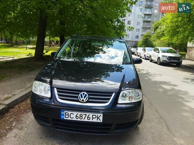Черный Фольксваген Туран, объемом двигателя 1.6 л и пробегом 255 тыс. км за 5700 $, фото 1 на Automoto.ua