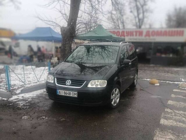 Чорний Фольксваген Туран, об'ємом двигуна 1.6 л та пробігом 300 тис. км за 4748 $, фото 1 на Automoto.ua
