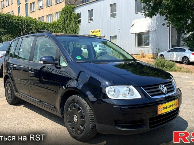 Черный Фольксваген Туран, объемом двигателя 1.4 л и пробегом 293 тыс. км за 3400 $, фото 1 на Automoto.ua