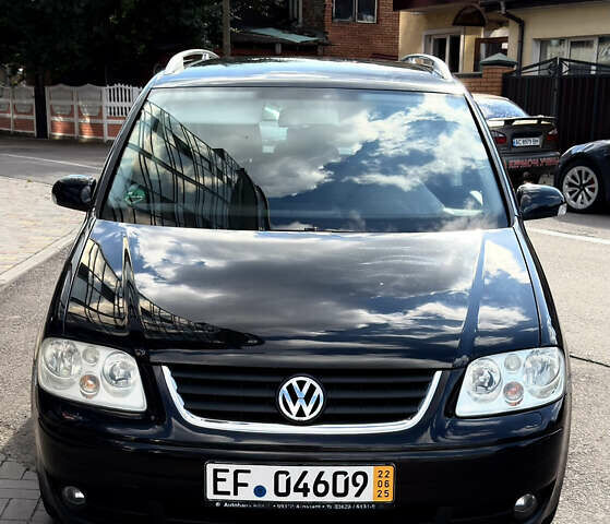 Черный Фольксваген Туран, объемом двигателя 1.6 л и пробегом 190 тыс. км за 6999 $, фото 1 на Automoto.ua