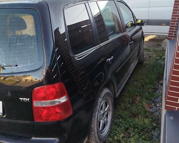 Чорний Фольксваген Туран, об'ємом двигуна 1.9 л та пробігом 327 тис. км за 5800 $, фото 1 на Automoto.ua