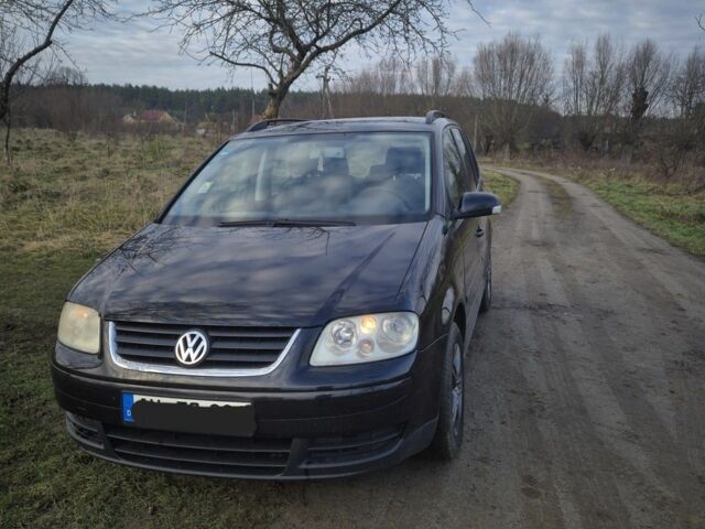 Черный Фольксваген Туран, объемом двигателя 1.9 л и пробегом 217 тыс. км за 2550 $, фото 1 на Automoto.ua