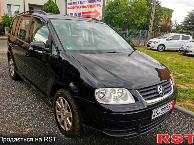 Черный Фольксваген Туран, объемом двигателя 2 л и пробегом 211 тыс. км за 2200 $, фото 1 на Automoto.ua