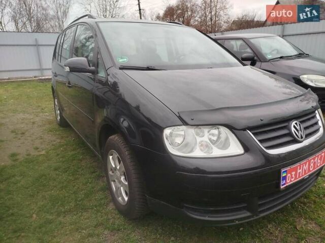 Черный Фольксваген Туран, объемом двигателя 1.6 л и пробегом 225 тыс. км за 6000 $, фото 1 на Automoto.ua