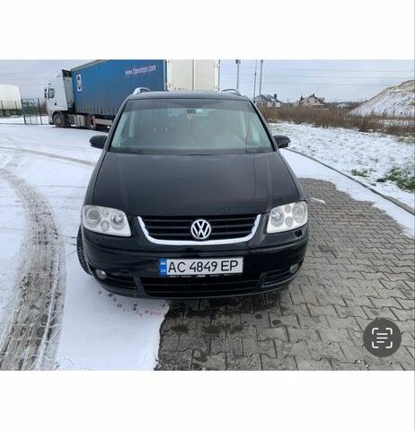 Чорний Фольксваген Туран, об'ємом двигуна 2 л та пробігом 345 тис. км за 6500 $, фото 1 на Automoto.ua