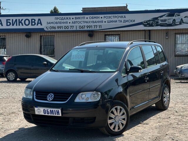 Черный Фольксваген Туран, объемом двигателя 1.6 л и пробегом 309 тыс. км за 5300 $, фото 1 на Automoto.ua