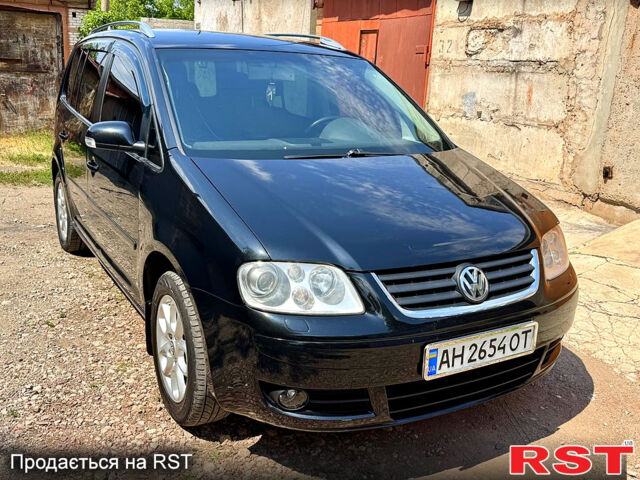 Чорний Фольксваген Туран, об'ємом двигуна 2 л та пробігом 277 тис. км за 6200 $, фото 1 на Automoto.ua