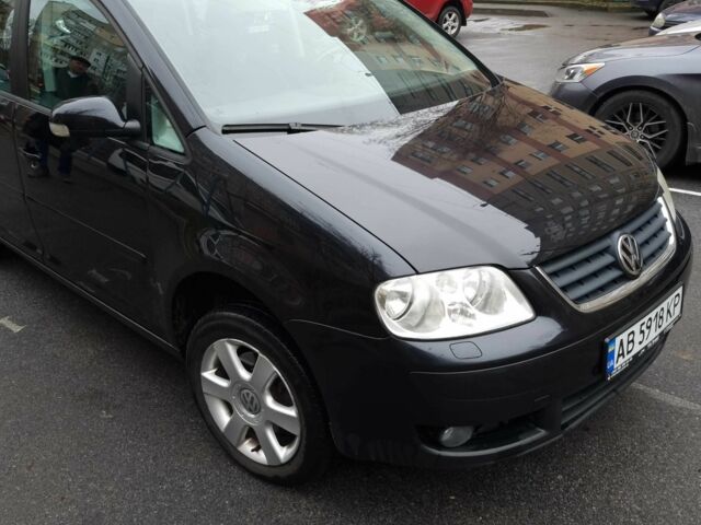 Черный Фольксваген Туран, объемом двигателя 1.4 л и пробегом 239 тыс. км за 5700 $, фото 1 на Automoto.ua