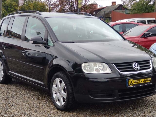 Черный Фольксваген Туран, объемом двигателя 1.6 л и пробегом 289 тыс. км за 5800 $, фото 1 на Automoto.ua