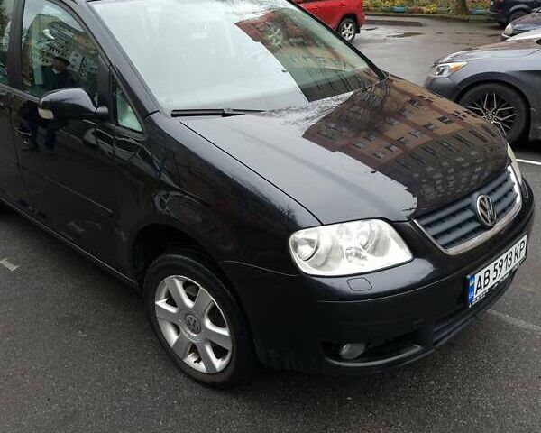 Черный Фольксваген Туран, объемом двигателя 1.39 л и пробегом 239 тыс. км за 5700 $, фото 1 на Automoto.ua