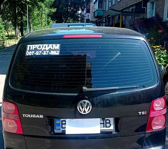 Черный Фольксваген Туран, объемом двигателя 1.4 л и пробегом 233 тыс. км за 6800 $, фото 1 на Automoto.ua