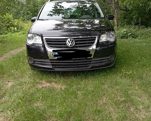 Черный Фольксваген Туран, объемом двигателя 2 л и пробегом 240 тыс. км за 5000 $, фото 1 на Automoto.ua