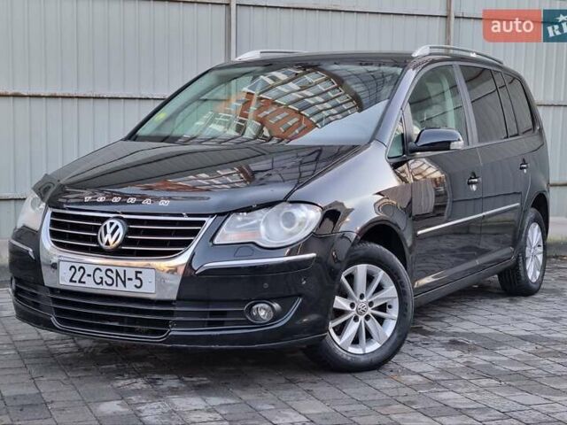 Черный Фольксваген Туран, объемом двигателя 1.4 л и пробегом 193 тыс. км за 7300 $, фото 1 на Automoto.ua