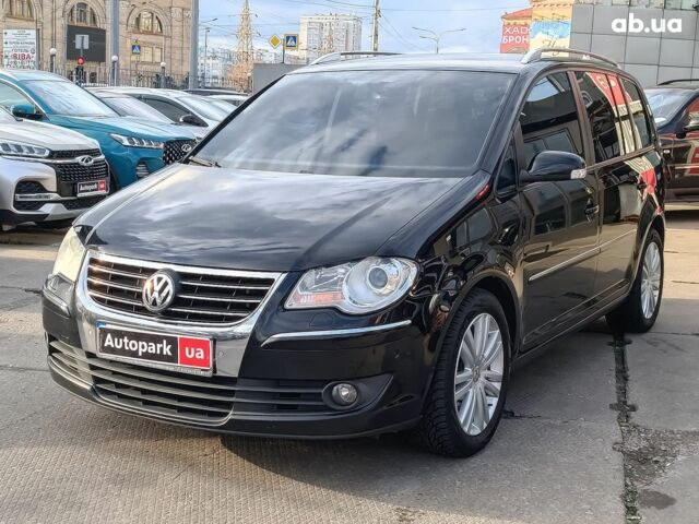 Чорний Фольксваген Туран, об'ємом двигуна 2 л та пробігом 260 тис. км за 9390 $, фото 1 на Automoto.ua