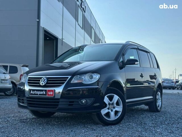 Черный Фольксваген Туран, объемом двигателя 2 л и пробегом 260 тыс. км за 7890 $, фото 1 на Automoto.ua