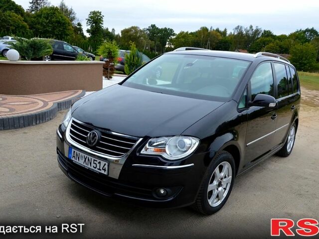 Черный Фольксваген Туран, объемом двигателя 2 л и пробегом 268 тыс. км за 2400 $, фото 1 на Automoto.ua