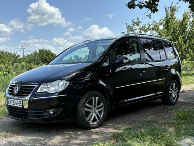 Черный Фольксваген Туран, объемом двигателя 1.4 л и пробегом 191 тыс. км за 8500 $, фото 1 на Automoto.ua