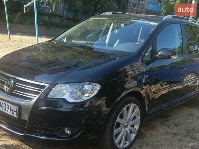 Черный Фольксваген Туран, объемом двигателя 1.39 л и пробегом 175 тыс. км за 9400 $, фото 1 на Automoto.ua