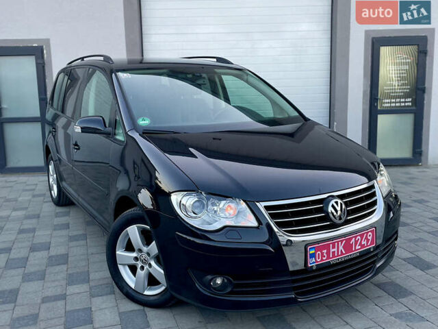 Чорний Фольксваген Туран, об'ємом двигуна 2 л та пробігом 292 тис. км за 8999 $, фото 1 на Automoto.ua