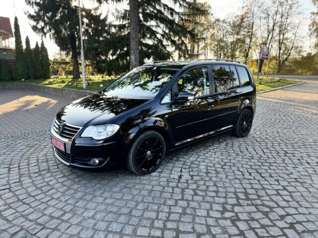 Черный Фольксваген Туран, объемом двигателя 1.4 л и пробегом 200 тыс. км за 7300 $, фото 1 на Automoto.ua