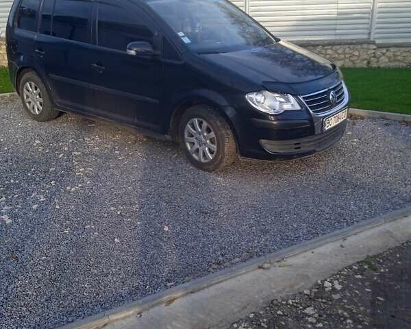 Черный Фольксваген Туран, объемом двигателя 1.9 л и пробегом 227 тыс. км за 7999 $, фото 1 на Automoto.ua