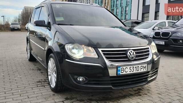 Черный Фольксваген Туран, объемом двигателя 1.4 л и пробегом 220 тыс. км за 7200 $, фото 1 на Automoto.ua