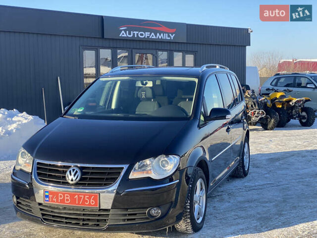 Черный Фольксваген Туран, объемом двигателя 1.4 л и пробегом 235 тыс. км за 6950 $, фото 1 на Automoto.ua