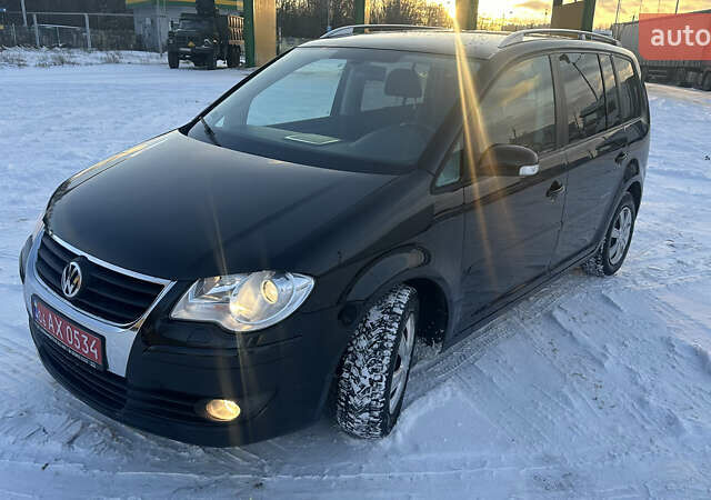 Чорний Фольксваген Туран, об'ємом двигуна 1.4 л та пробігом 145 тис. км за 8699 $, фото 1 на Automoto.ua