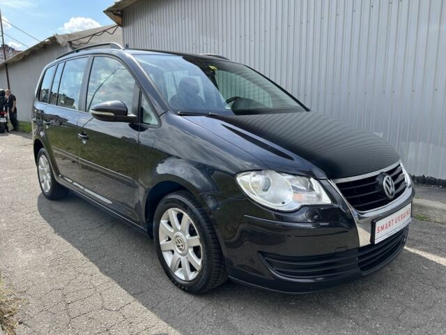 Черный Фольксваген Туран, объемом двигателя 1.4 л и пробегом 203 тыс. км за 6550 $, фото 1 на Automoto.ua